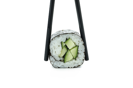 Chopsticks with maki isolated on white background, a Food & Drink Photo by AtlasStudio