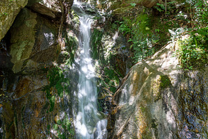 Waterfall at Mitaki-Dera temple in Hiroshima surrounded by mossy, a Nature Photo by GoodGoods