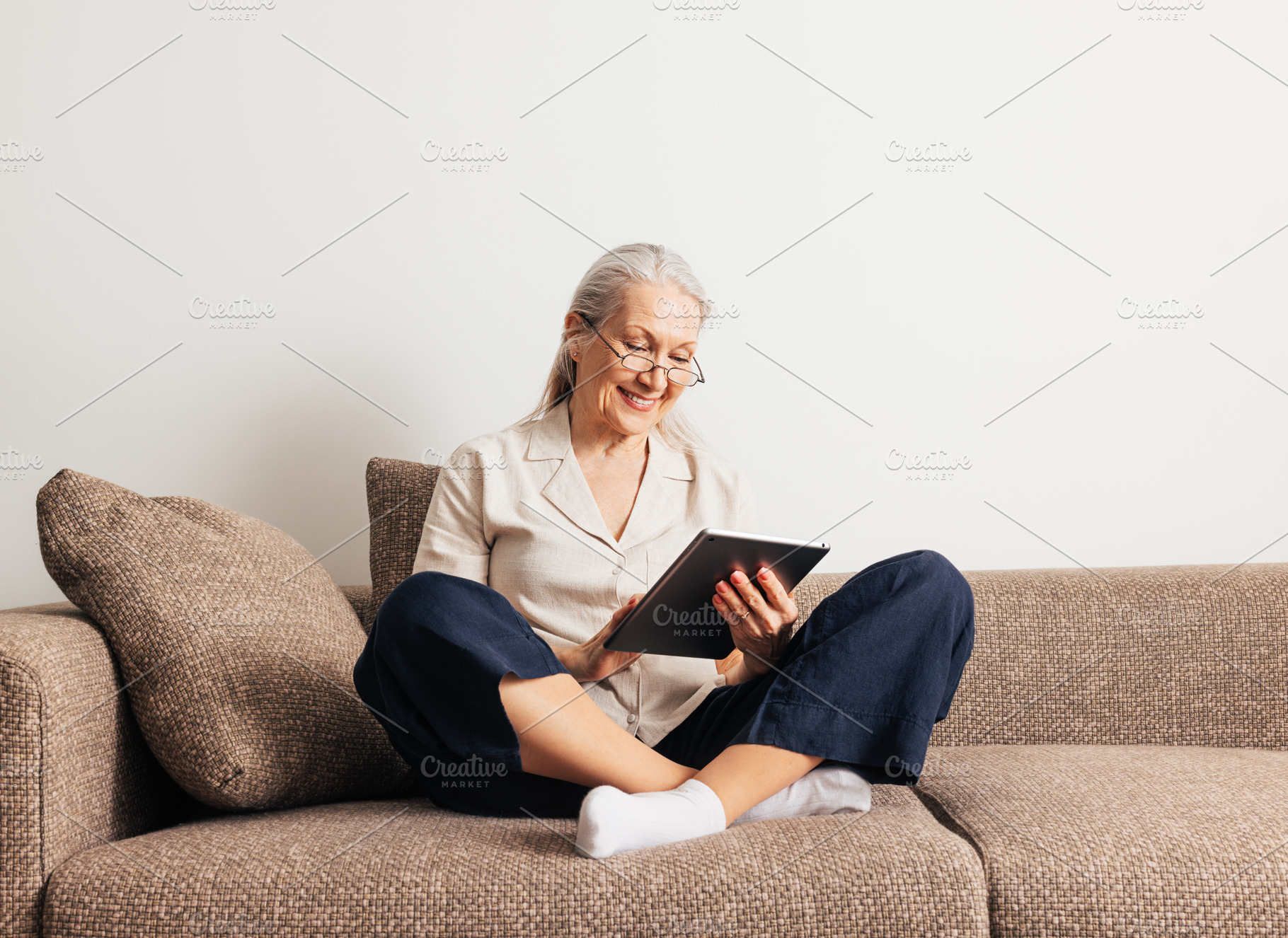 Cheerful aged female in glasses, a Person Photo by Artem Varnitsin