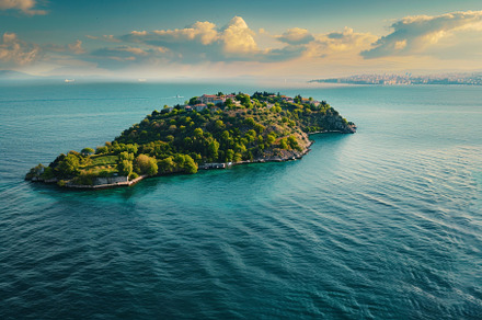 A picturesque island emerges from tu, a Photo by Tanuart