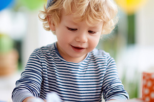 Cute toddler boy opening gifts, a Person Photo by MistyDay