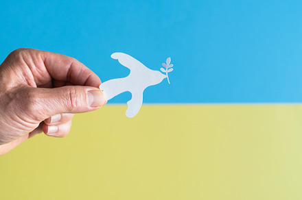 Hand holding white dove with paper o, an Arts & Entertainment Photo by Mineko