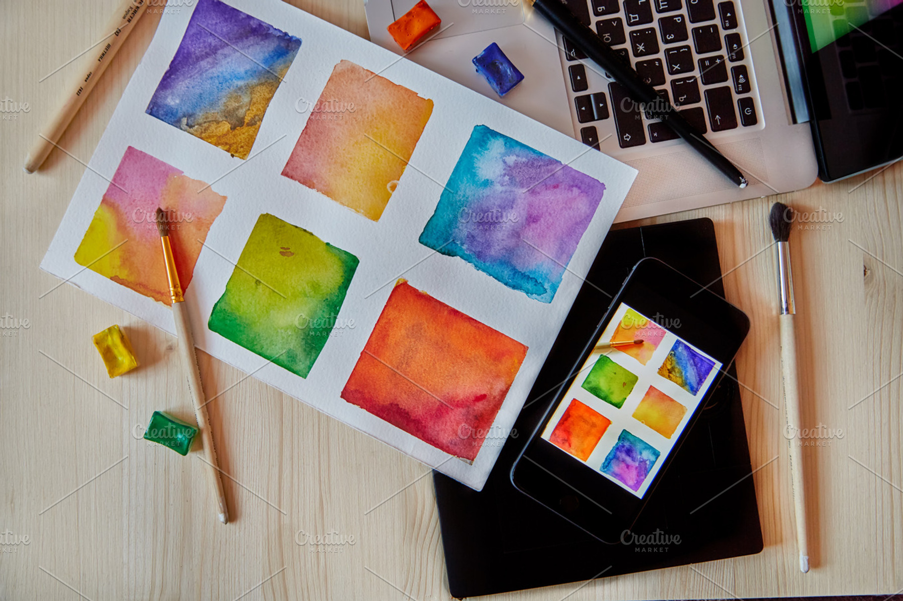 smartphone on arts hand drawn background with digital artist supplies: brushes, laptop, paper, an Arts & Entertainment Photo by ArtChamomile