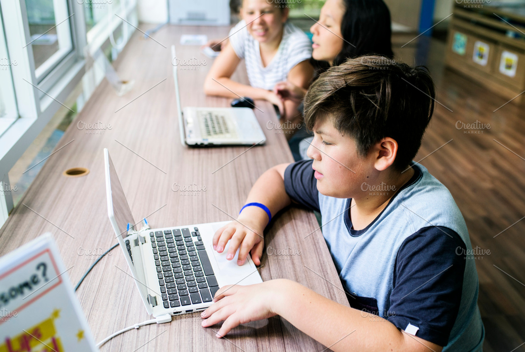 Students in school, a Photo by rawpixel