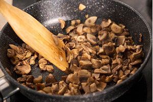 Mushrooms being in a skillet with a, a Food & Drink Photo by darksoul72