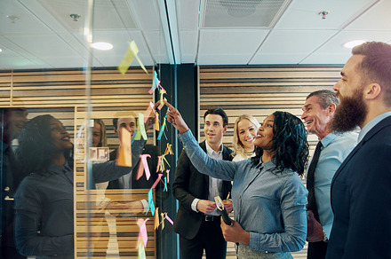 Cheerful�entrepreneur team talking in the office, a Person Photo by Stefan & Janni