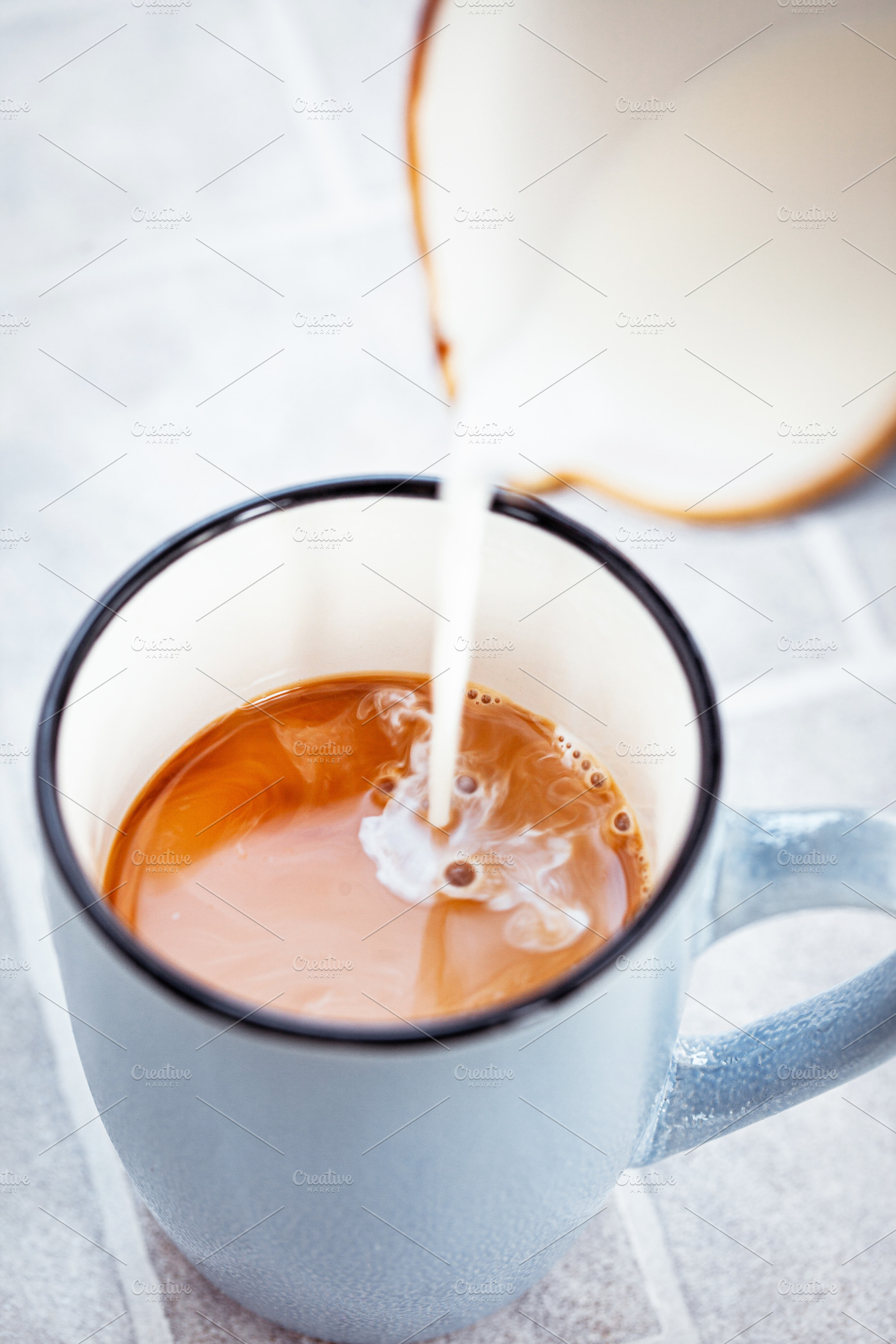 Hot black americano coffee and milk, a Food & Drink Photo by Kate S