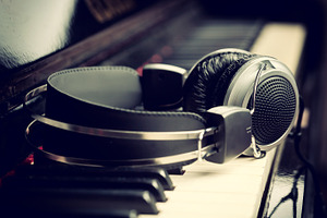 Headphones on piano keyboard