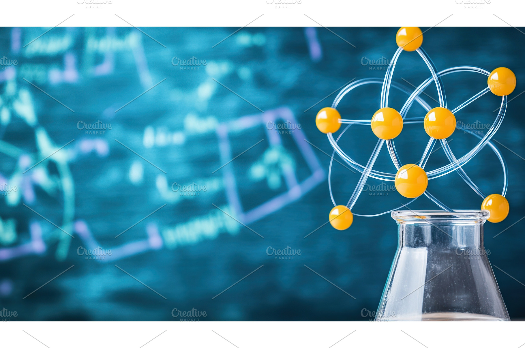 Atom model with chalkboard formulas, a Technology Photo by Lermont51