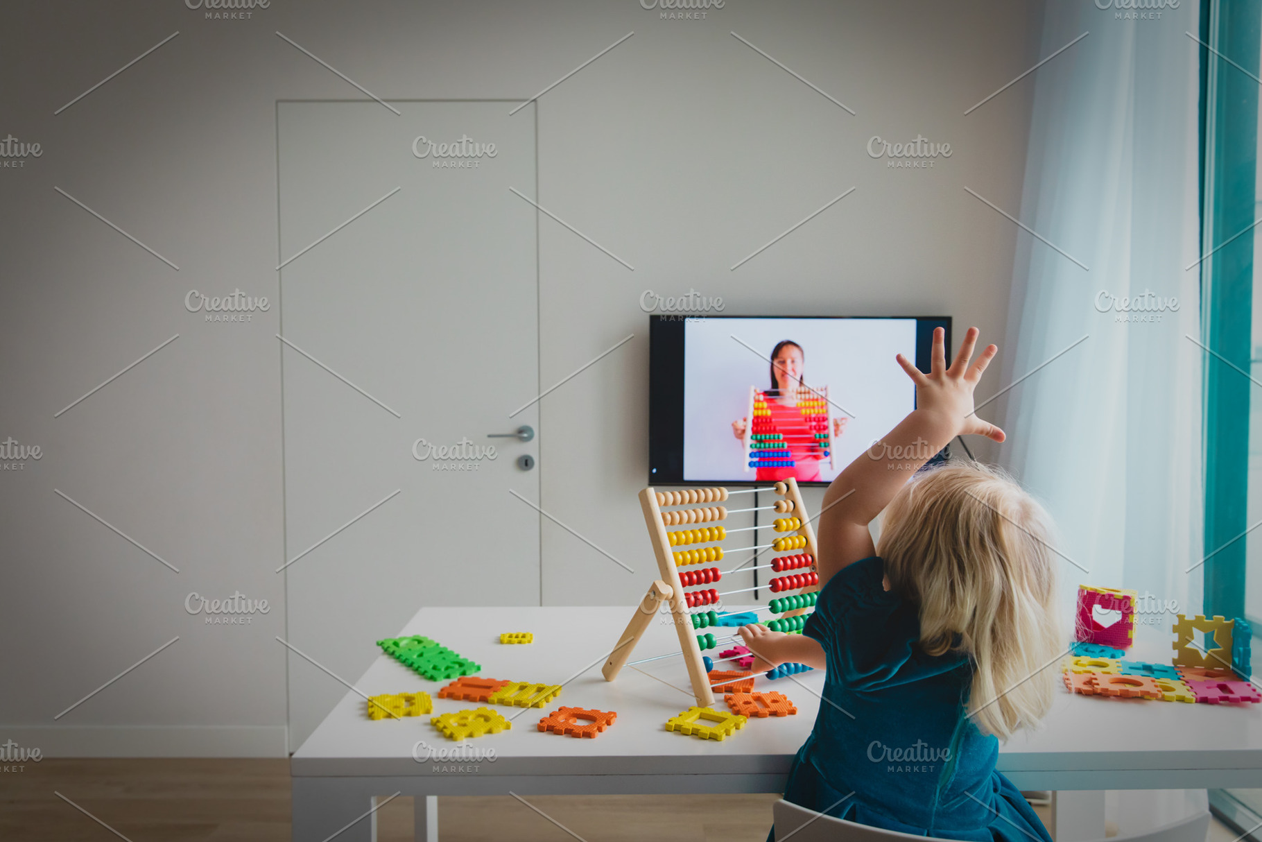 Little girl learning at home containing online, video, and lesson, a School & Education Photo by Nadezhda_Prokudina