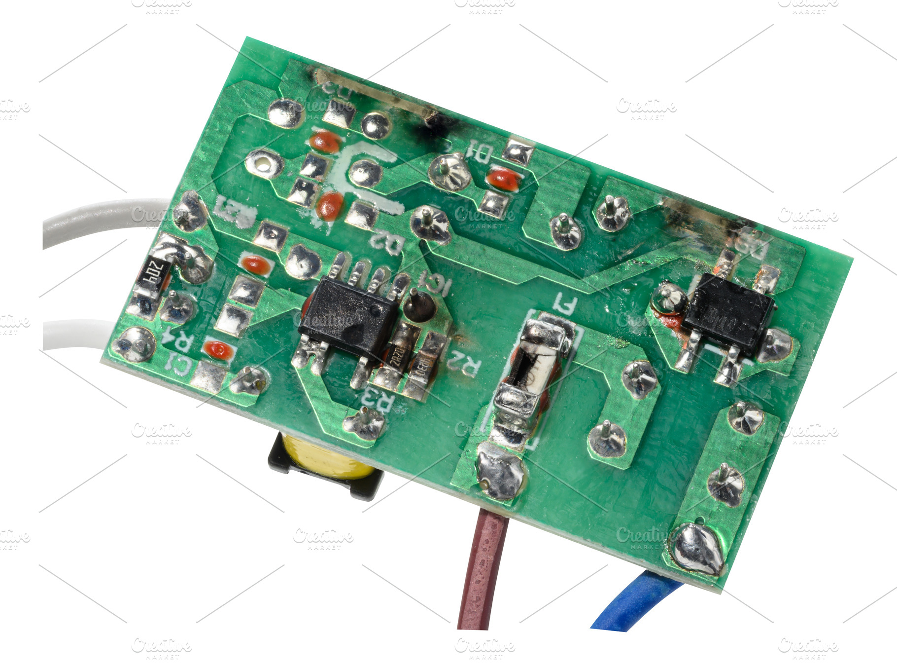 Green electronic board with various components and several wires, a Technology Photo by ndanko