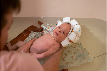 Baby having a bath wearing special, a Person Photo by Koldunova