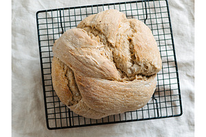 Sourdough knot bread cooling on wire