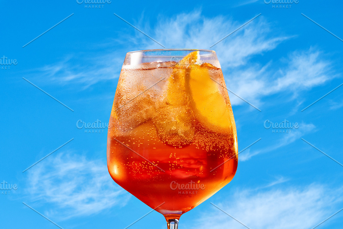 Glass of aperol spritz cocktail, a Photo by zeStudioPhoto (Photo 2 of 2)