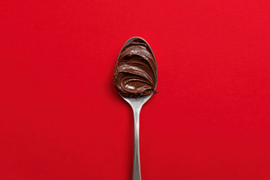 Chocolate spread on a spoon, a Photo by Beautiful things