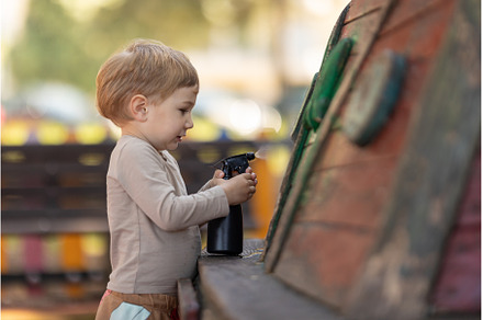 A little boy sprays water on a, a Person Photo by Barcelona_dreams