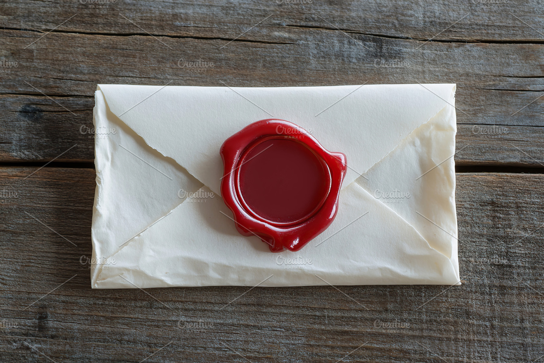 Envelope with red wax seal, an Abstract Photo by AlyaAnd