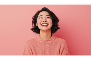 Asian woman smiling broadly against, a Person Photo by Sergey Kotenev