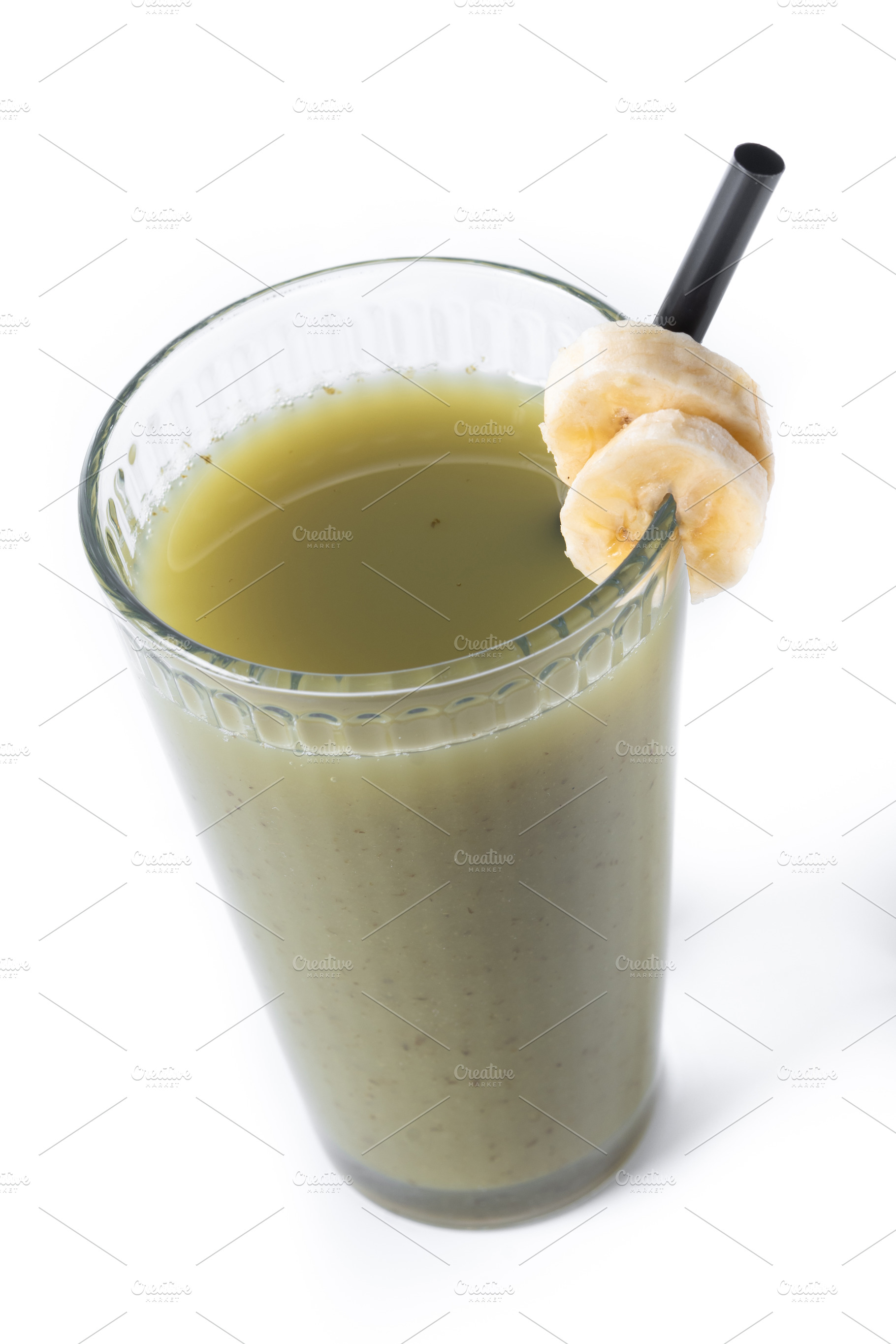 Green smoothie with spinach,banana, apple, and lemon isolated on white backgrou, a Food & Drink Photo by etorres69