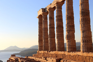 The ancient temple of poseidon containing old, sun, and sky