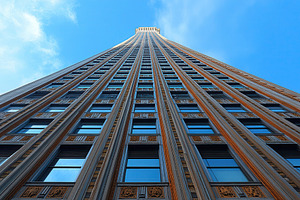 Tall historic building reaching towa, a Photo by Tanuart