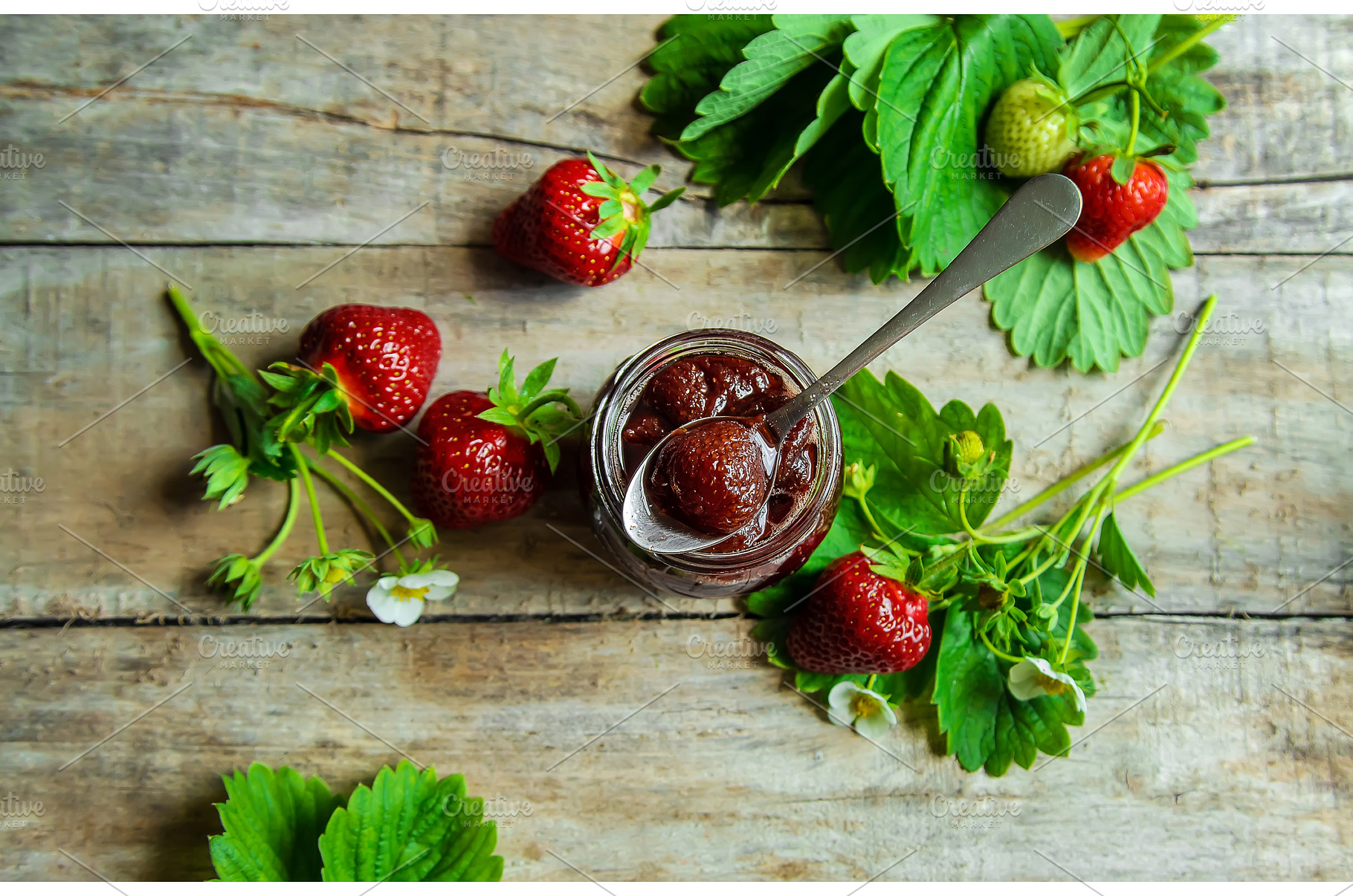 Homemade strawberry jam in a jar, a Food & Drink Photo by yanadjana