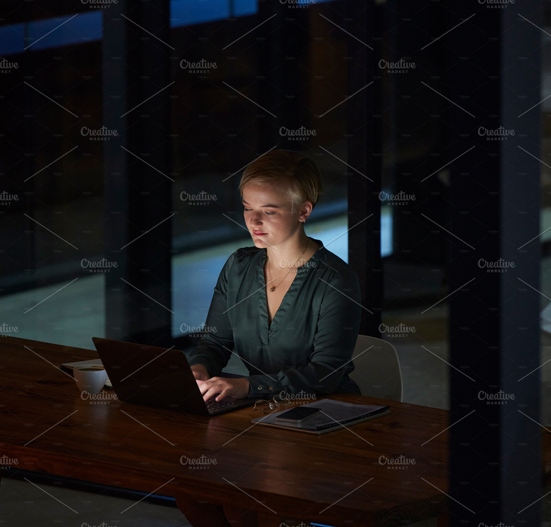 Night, laptop and typing with woman in office for planning, overtime and corporate strategy. Deadline, technology and email with employee at desk for business proposal, online trading and internet, a Photo by Peopleimages.com