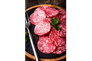 Sliced spicy tasty salami sausage, a Food & Drink Photo by Yulia Furman
