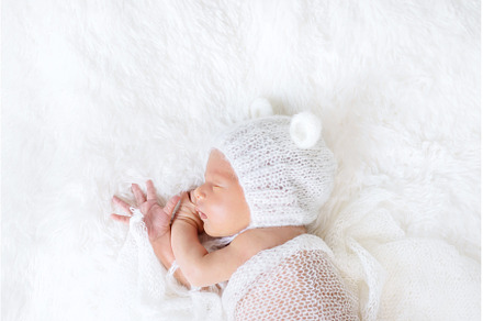 Newborn baby sleeps in a hat, a Beauty & Fashion Photo by yanadjana