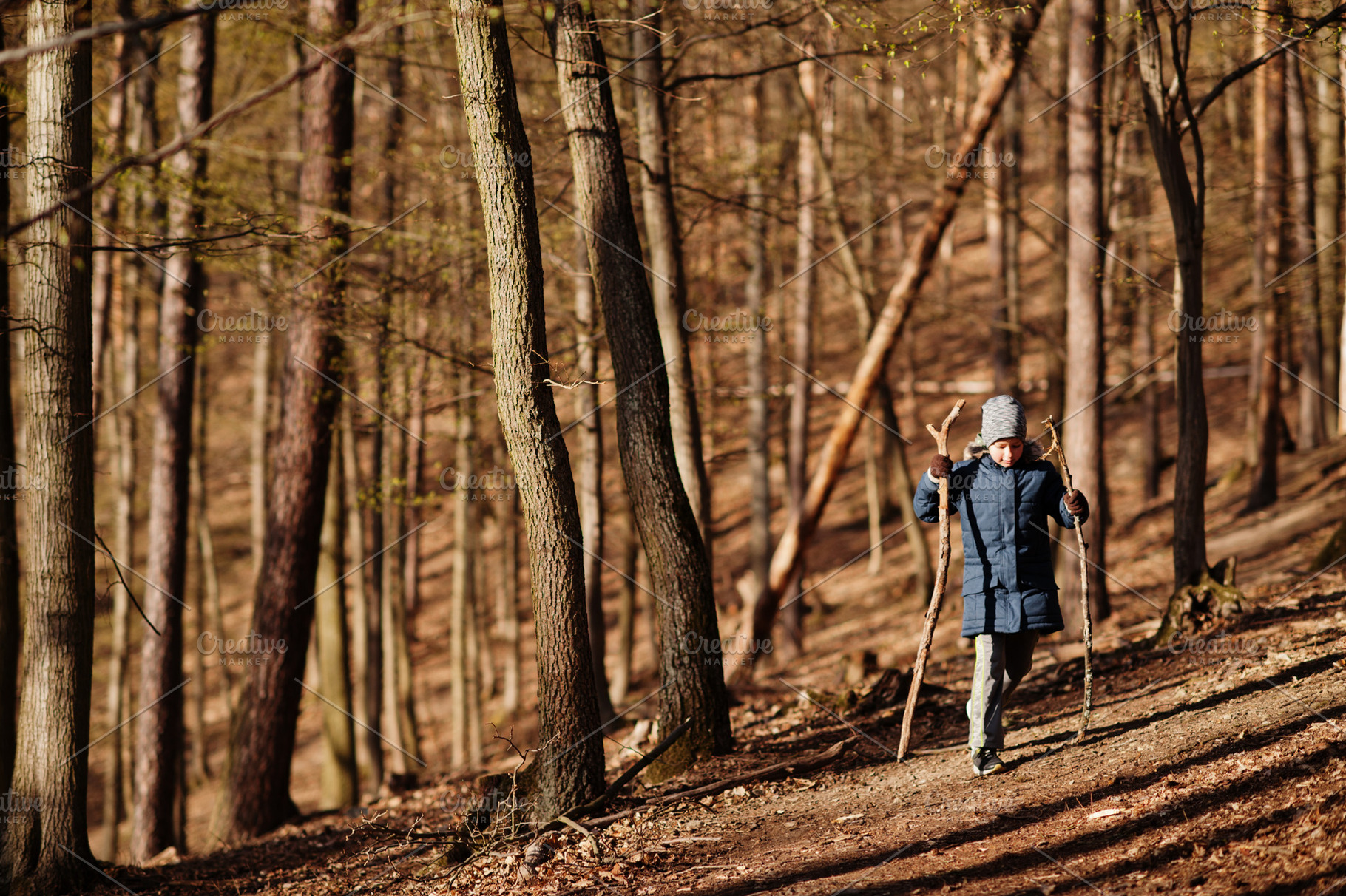 Young boy wear jacket and hat in early spring forest., a Person Photo by AS photostudio