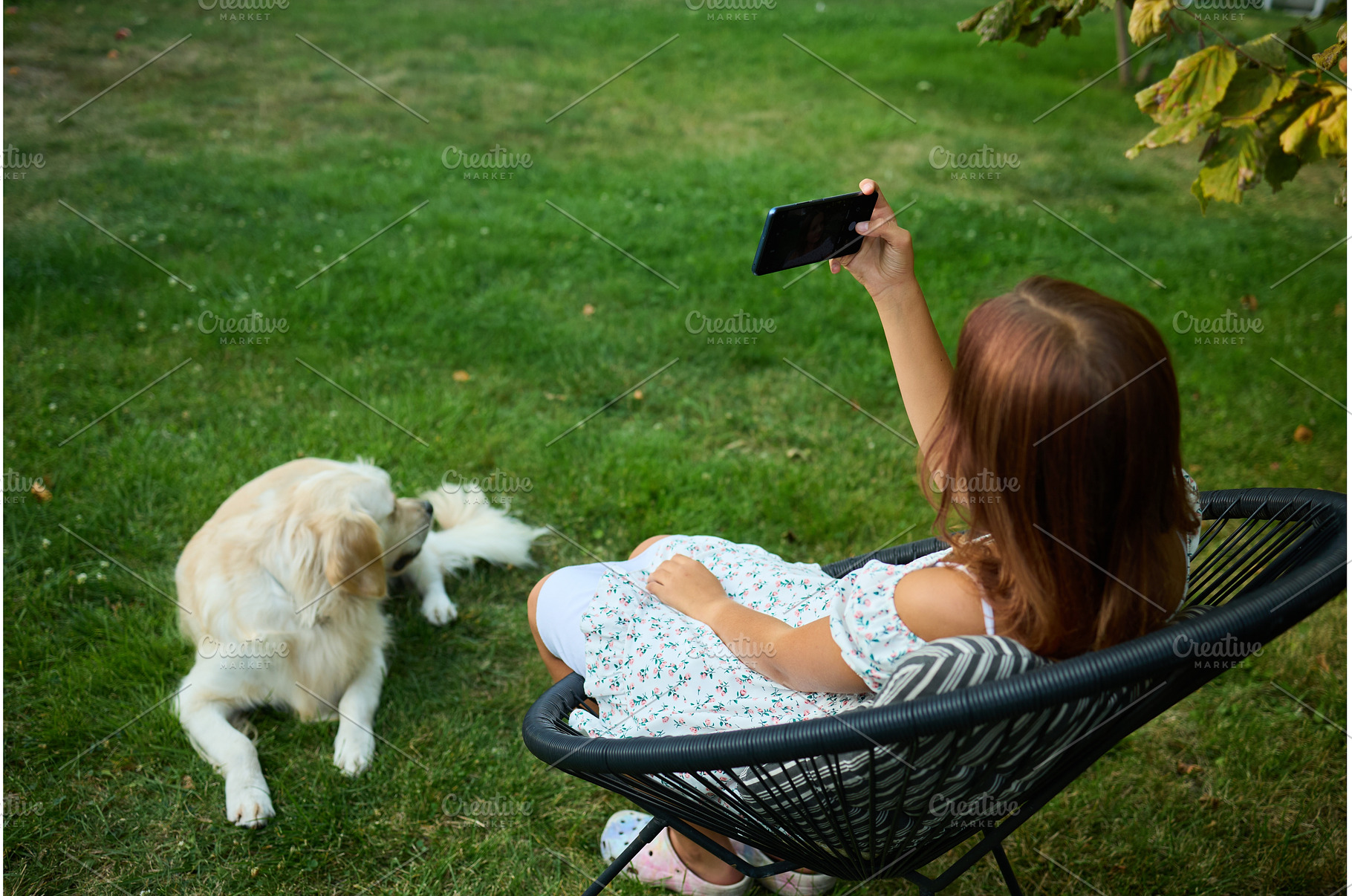 Young girl takes selfie in garden, a Nature Photo by IlliaBondarPhotography