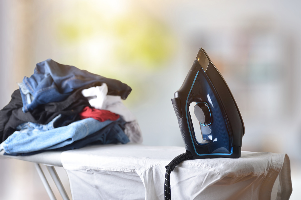 Ironing clothes with an iron, board, and clothes in room, a Technology Photo by Davizro's Market (Photo 1 of 2)