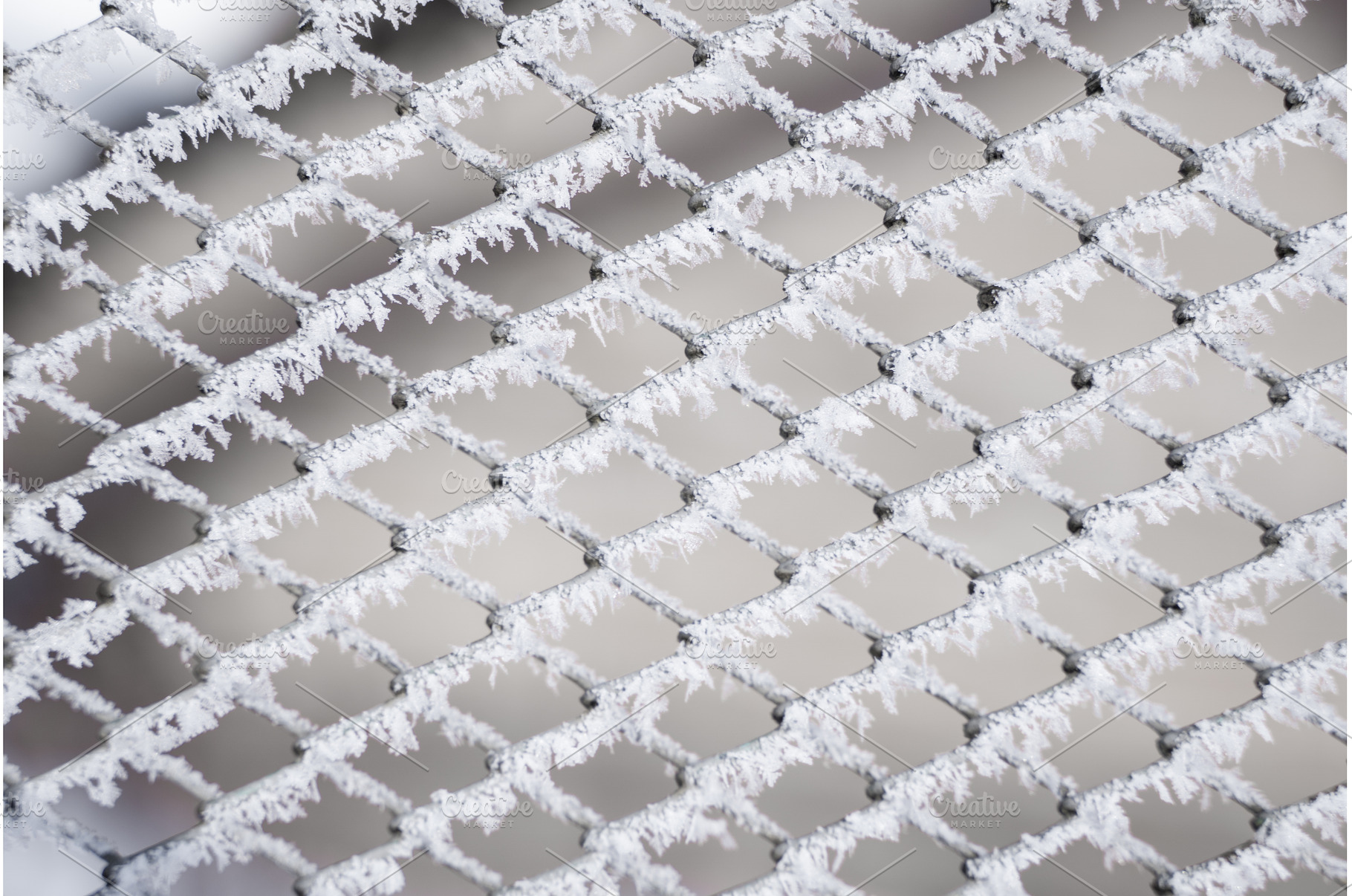 Close-up view of frost-covered metal, an Abstract Photo by volodymyrshtun13795