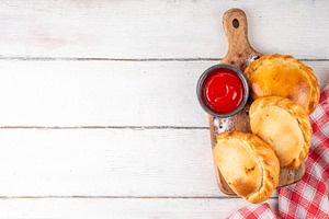 Homemade golden baked hand pies, with meat filling, a Food & Drink Photo by Rimma