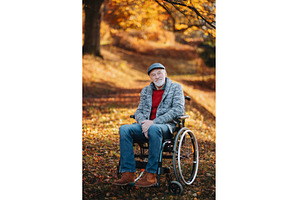 Pensive older man in wheelchair in, a Person Photo by HalfPoint