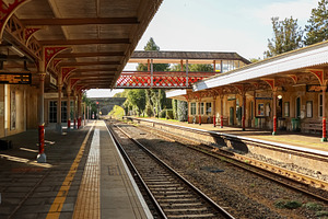 Victorian era train station platform and tracks, transport infra, a Photo by Studio ANNA