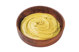 Creamy pistachio paste with smooth glossy texture in wooden bowl, a Food & Drink Photo by composter-box@mail.ru