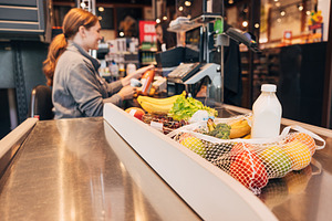 Products in a grocery store, a Person Photo by Artem Varnitsin