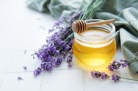 Jar with honey and fresh lavender flowers, a Food & Drink Photo by Olena Rudo