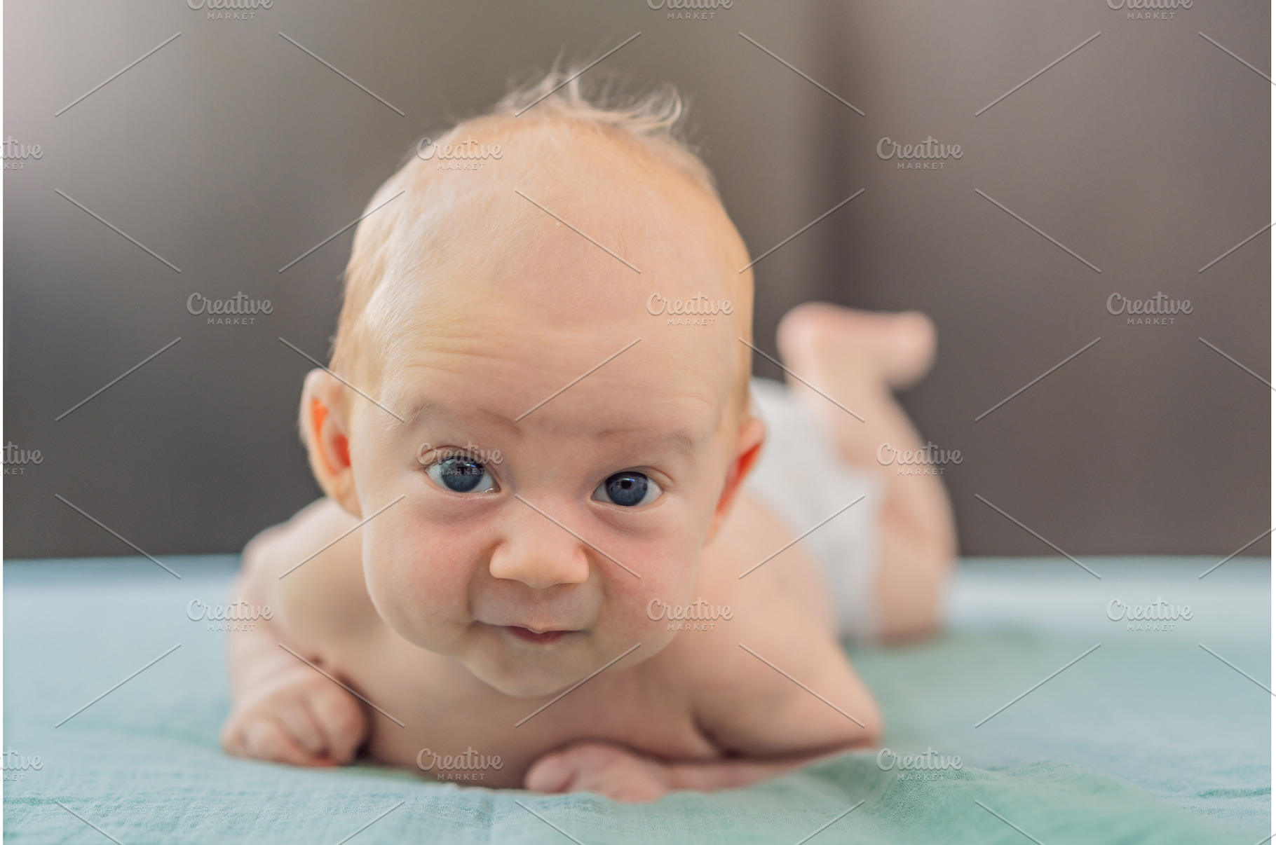One-month-old baby lying on tummy, a Person Photo by Elizaveta Galitskaya
