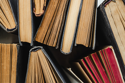 Stack of vintage books lying on the table, a School & Education Photo by Svetlana Barchan