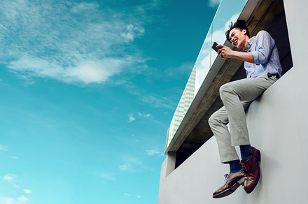Happy Smiling Young Businessman in Casual wear Using Mobile Phon, a Person Photo by salmon.black
