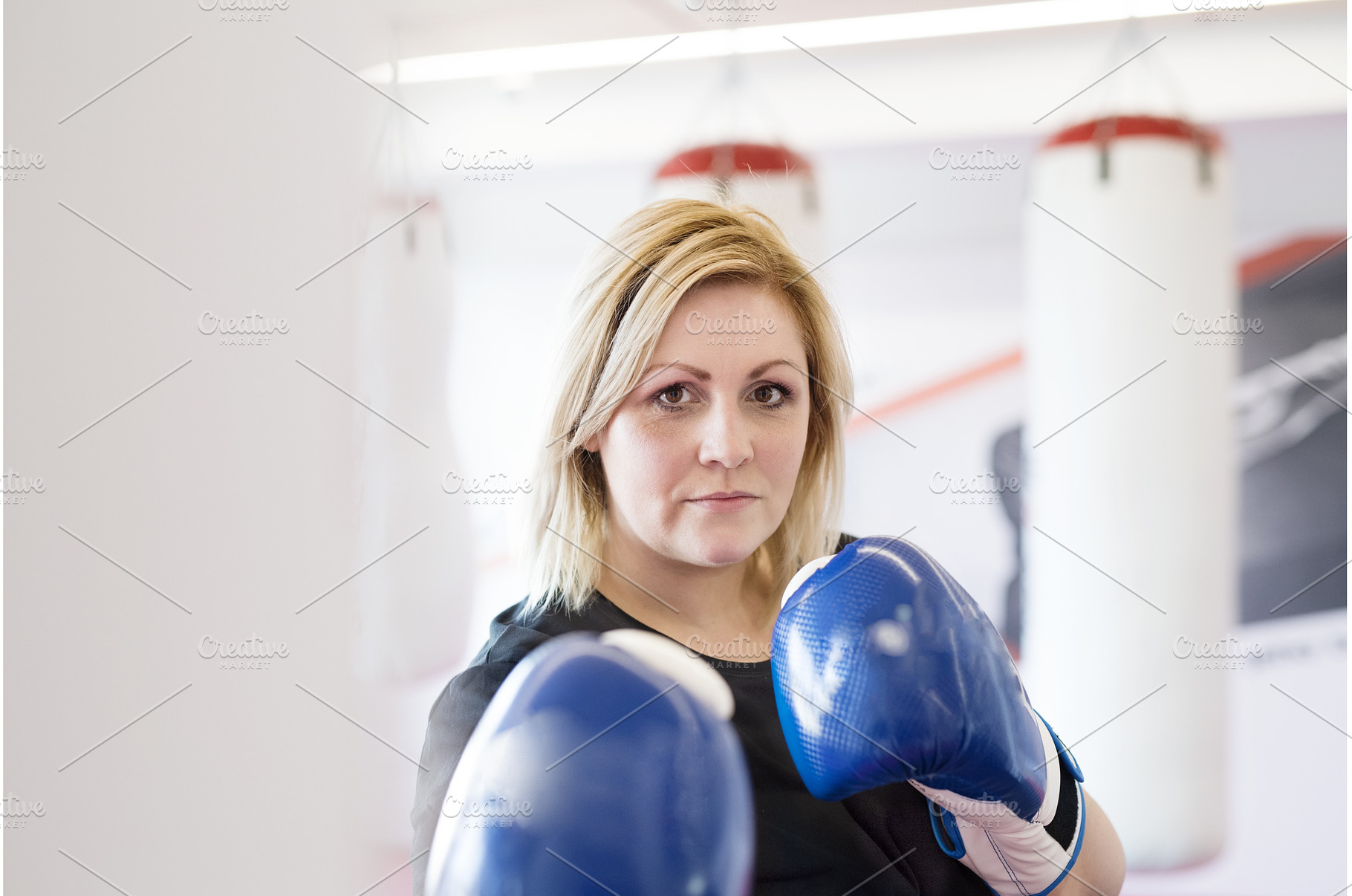 Overweight woman is working out in, a Sports & Recreation Photo by HalfPoint