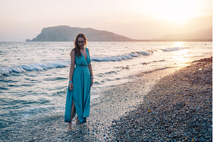 Woman in Flowing Dress on Seaside, a Person Photo by Jan Jack Russo Media