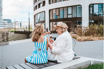 Grandma and granddaugter eating ice