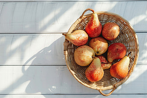Ripe pears in basket on wooden table, a Food & Drink Photo by AlyaAnd