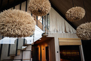Modern interior design with unique pendant lights and wooden decor elements, a Photo by AS photostudio
