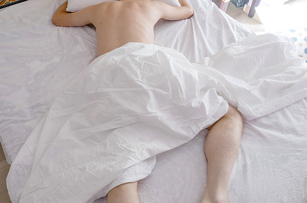 Portrait of a man lying on bed, a Person Photo by Shootdiem