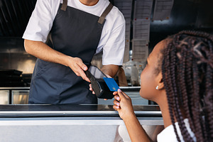 Cropped shot of a food truck owner, a Technology Photo by Artem Varnitsin