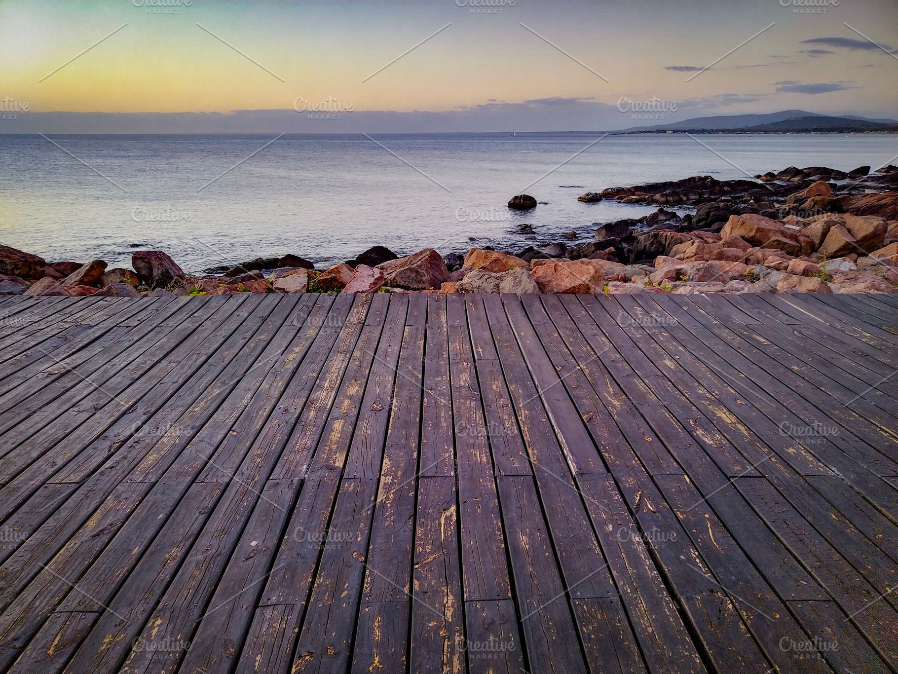 Boardwalk leading to the sea at sunset, piriapolis, uruguay, a Nature Photo by DanFLCreativo